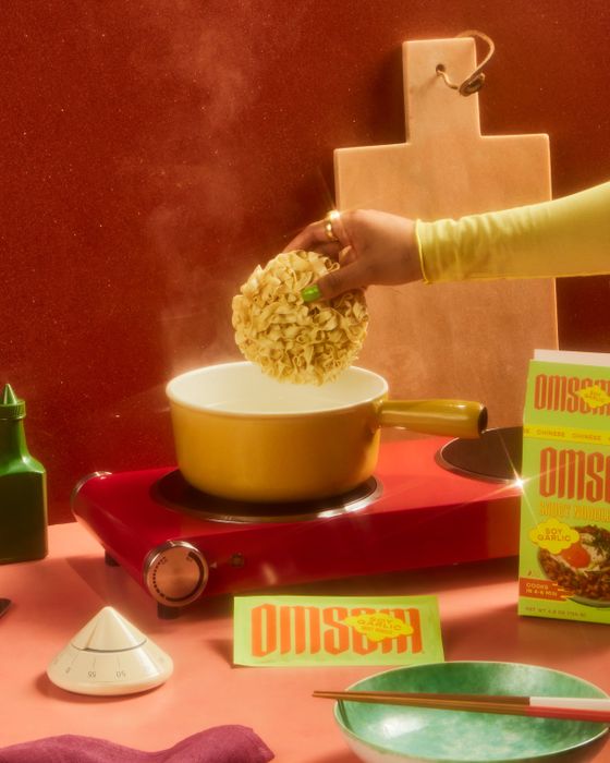 A model cooking noodles in a pot
