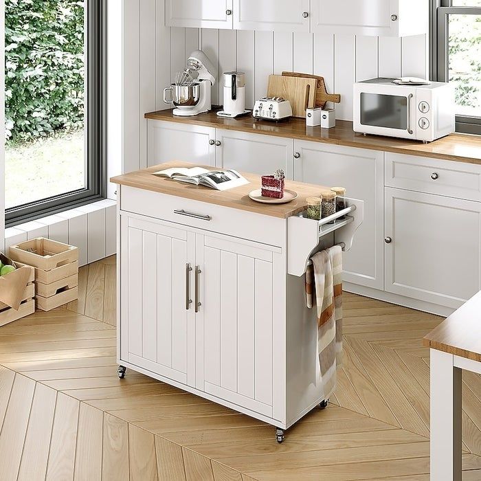A mobile island cart with built-in cabinets