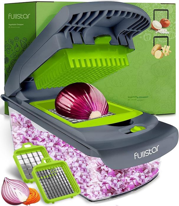 Fullstar vegetable chopper, with its lid open, efficiently chopping a red onion into small cubes. It includes multiple attachments for different chopping styles, perfect for any kitchen task.