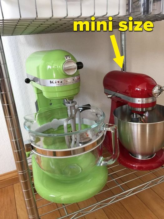A reviewer’s red KitchenAid mixer next to the full-size version for comparison