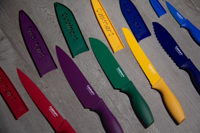 A colorful set of six knives, each with a matching blade guard for protection