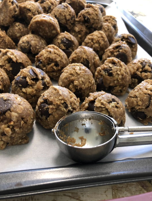 A reviewer's photo showcasing perfectly sized cookie dough balls neatly arranged behind the cookie scoop