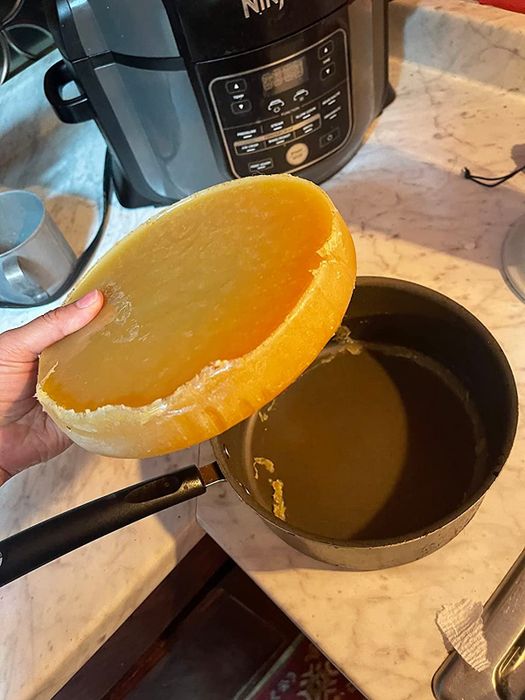 Grease solidifying as it pours out of a pan