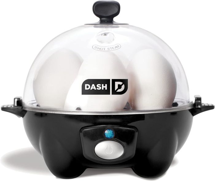 Dash Rapid Egg Cooker steaming eggs beneath a clear lid