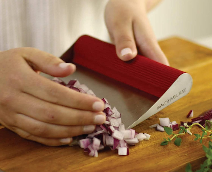 A model using a bench scraper to collect red onion