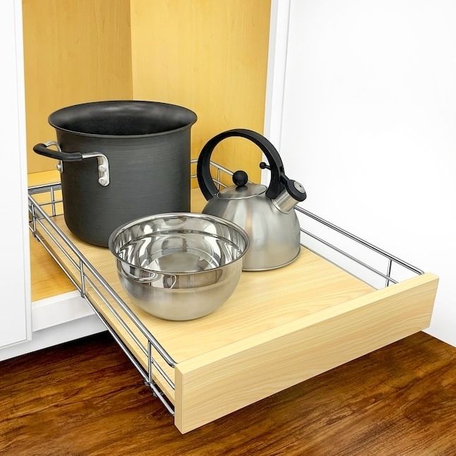 A pull-out kitchen drawer featuring a black pot, kettle, and mixing bowl