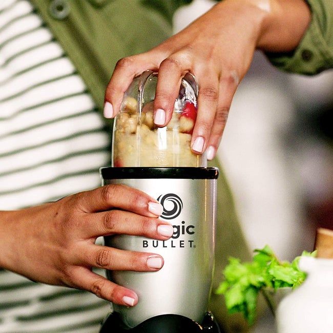 A model blending fruits in the Magic Bullet