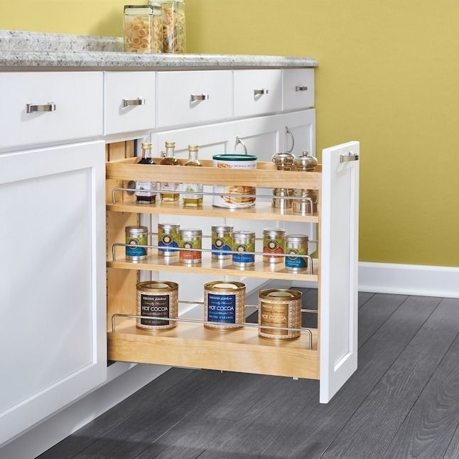 A pull-out, tiered kitchen cabinet organizer