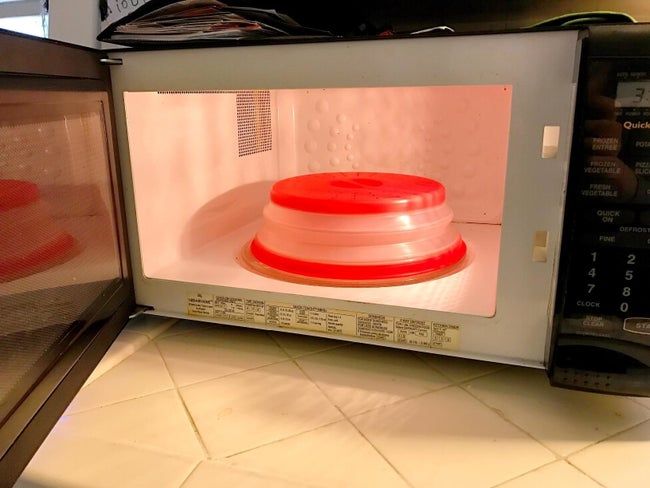 A reviewer’s photo showing off the red microwave food cover