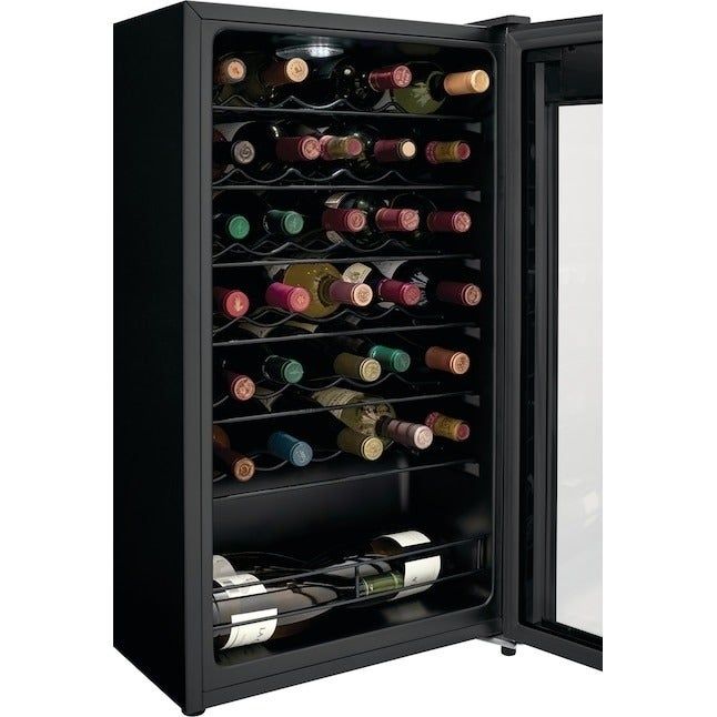 A wine fridge packed with shelves