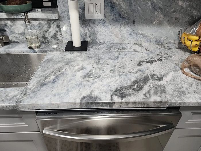 A reviewer’s clear cutting board displayed on their countertop.