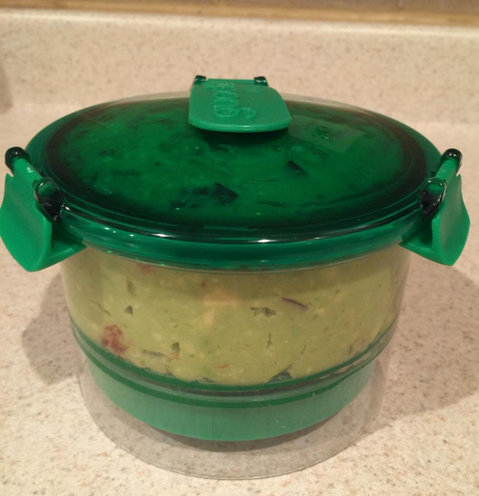 A reviewer's photo of the container filled with guac