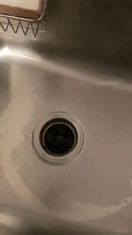 A reviewer gif showing the garbage disposal cleaner foaming up