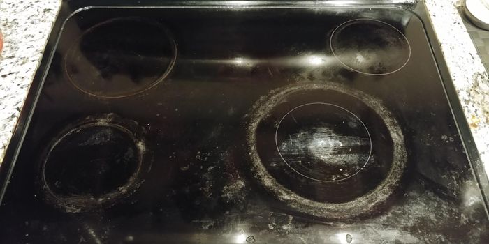 A reviewer's oven before using the scrubbing pads