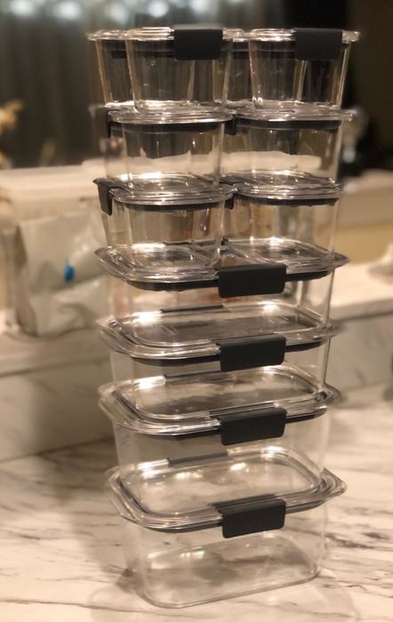 A reviewer photo of the 24-piece clear container set neatly stacked from the largest at the bottom to the smallest on the top