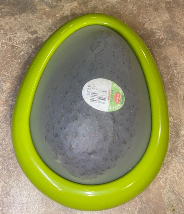 A reviewer's photo of an avocado stored in the saver container