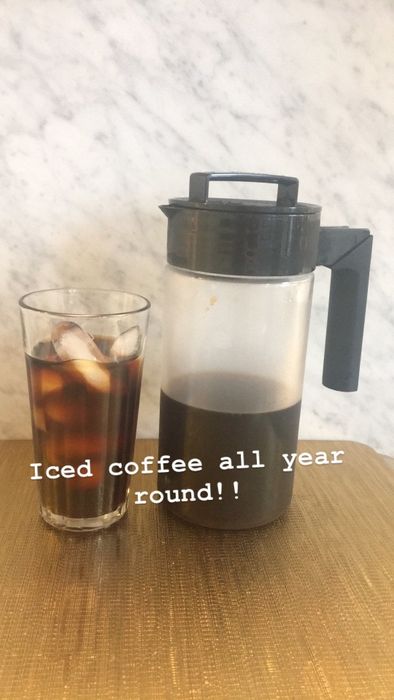 The same Mytourer's review photo of the finished cold brew with a caption that reads 'Iced coffee all year round'