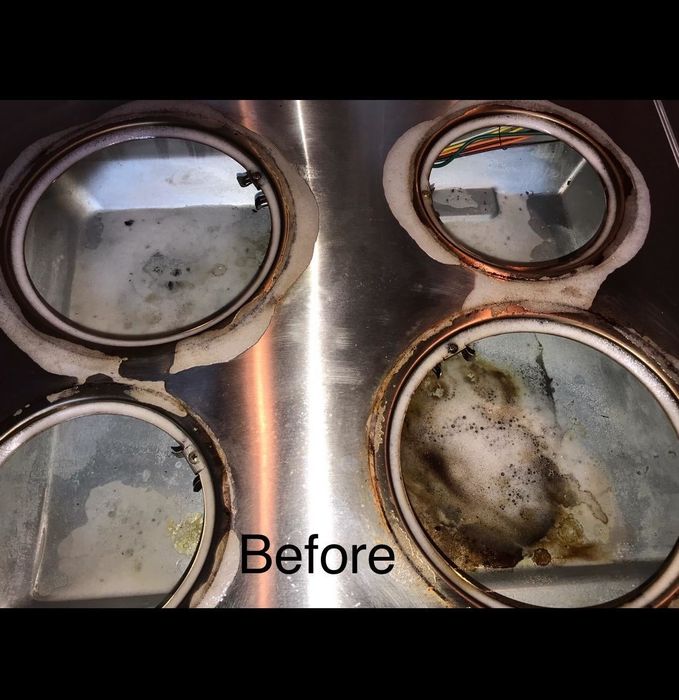 A reviewer’s photo showing the stove top before using Bar Keeper's Friend Soft Cleanser