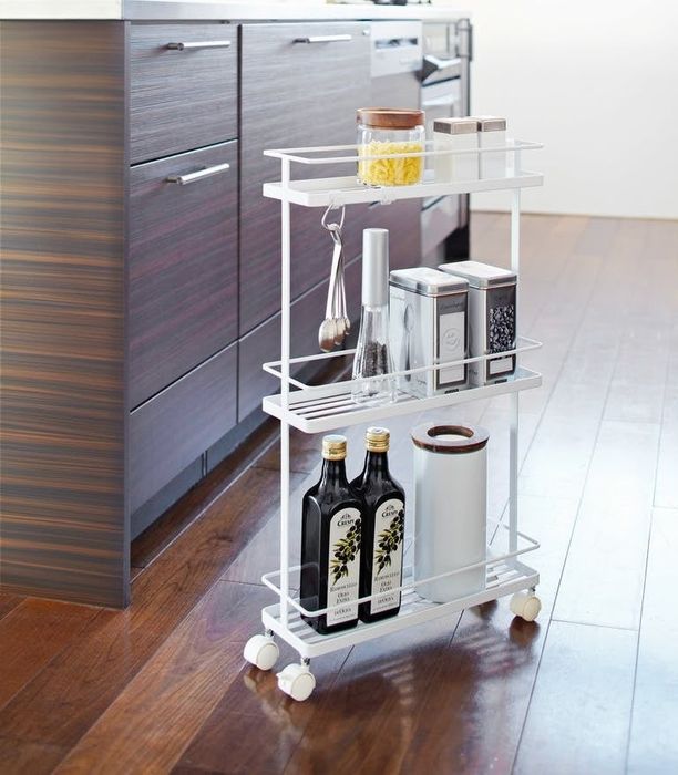 the white rolling cart neatly placed in a kitchen