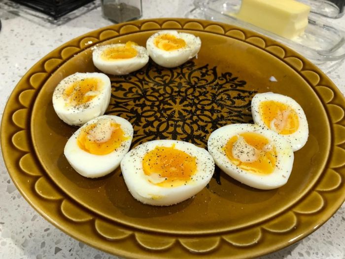 A few soft-boiled eggs freshly made in the egg cooker