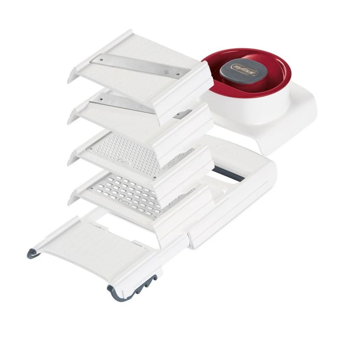 The tool with two slicers and two graters displayed on a counter