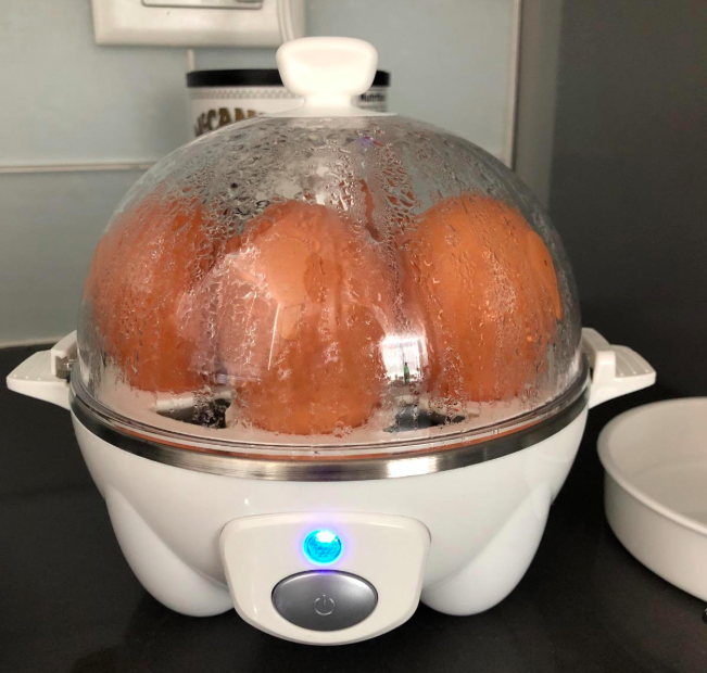 A reviewer’s photo of the rapid egg cooker with six eggs inside.
