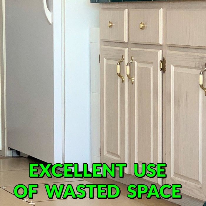 Reviewer's storage tower fits neatly between a fridge and a cabinet