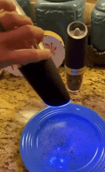 A reviewer demonstrating the gravity shaker in action