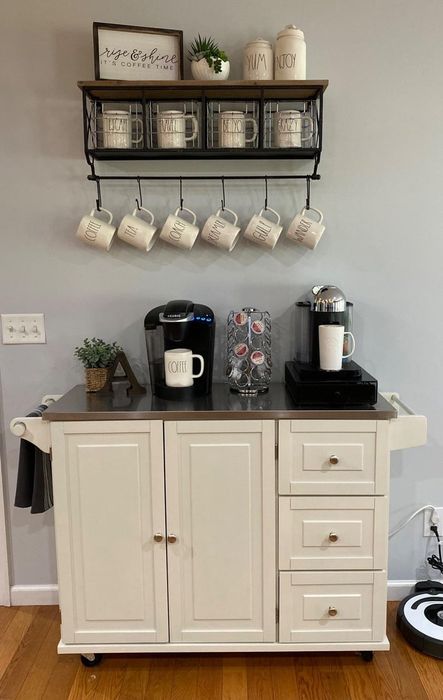 The kitchen cart functioning as a coffee station, complete with three drawers and a cabinet