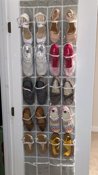 Reviewer using the organizer to store kitten heels and slip-on sneakers