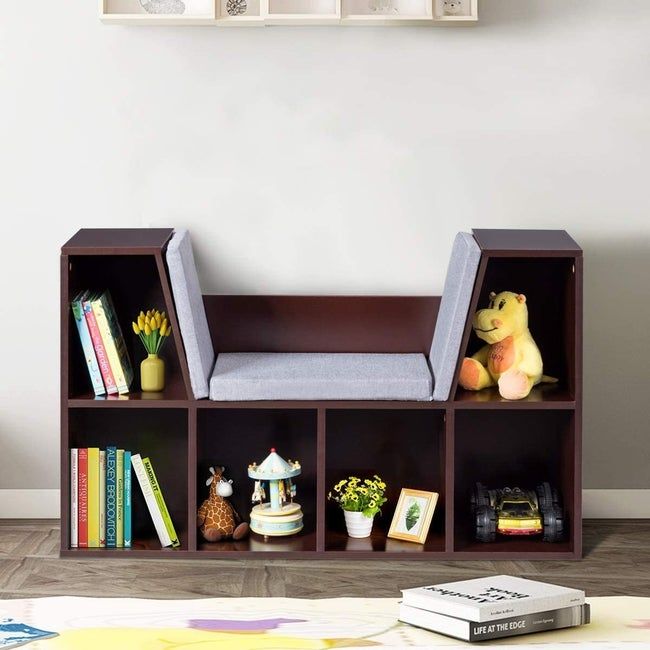 A five-shelf bookcase with a padded seat in the center for reading comfort.