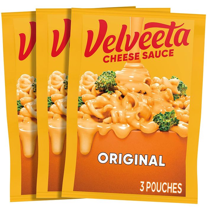 Three pouches of creamy cheese sauce.