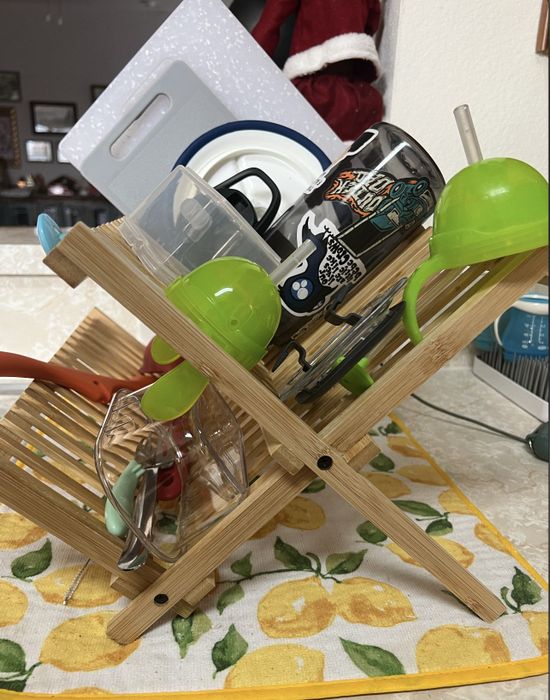 The bamboo drying rack in use, holding dishes.