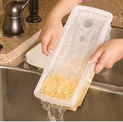 A model demonstrating the use of the built-in strainer in the pasta maker to pour the water out into the sink.