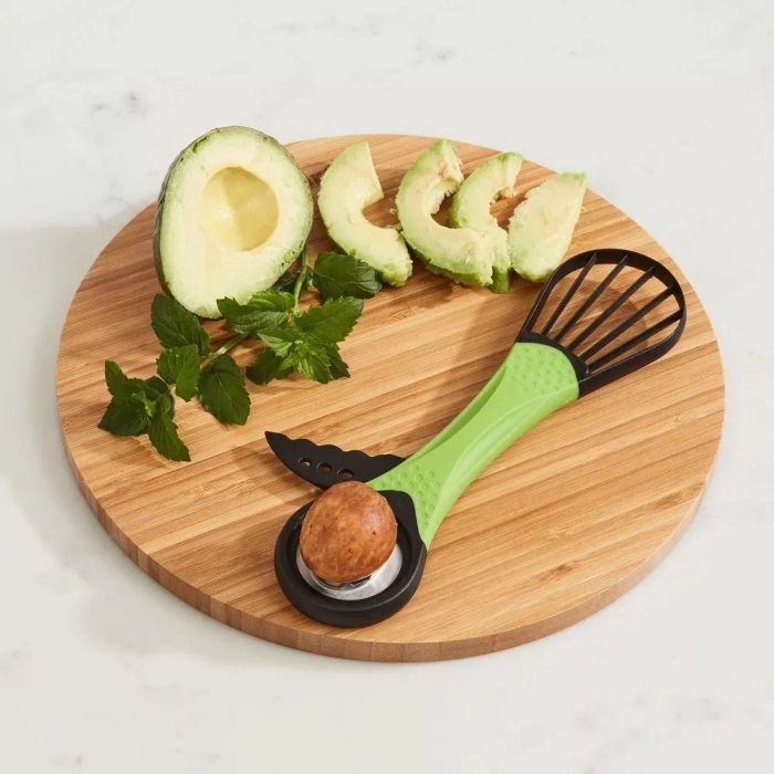 A multifunctional avocado tool that cuts, pits, and slices avocados effortlessly.