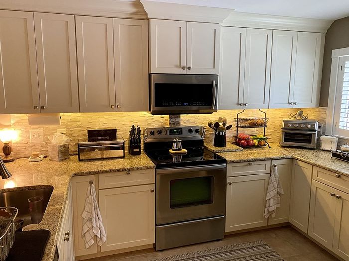 A reviewer's kitchen countertop is glowing with under-cabinet lights