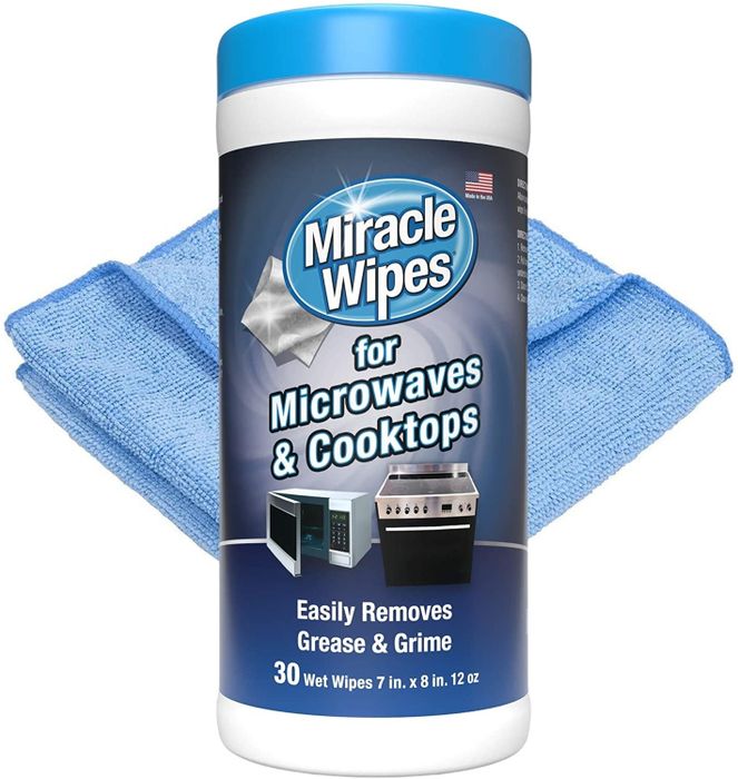 A jar of Miracle Wipes for Microwave and Cooktops, accompanied by a microfiber cloth.