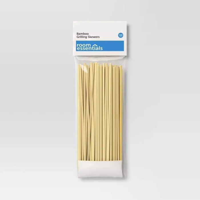 A pack of bamboo grilling skewers labeled 'Room Essentials'. The skewers are neatly packed in a clear bag with white top and bottom edges.
