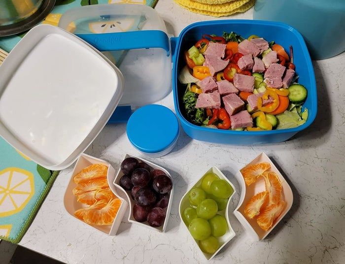 Reviewer image showing the disassembled lunch box with food neatly arranged in each compartment