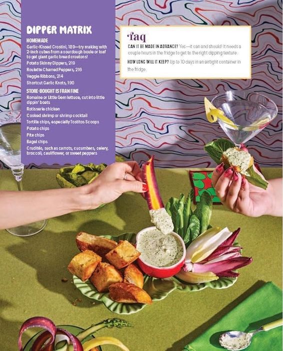 Two hands dipping vegetables into separate bowls of dip on a table filled with various snacks and dip recipes
