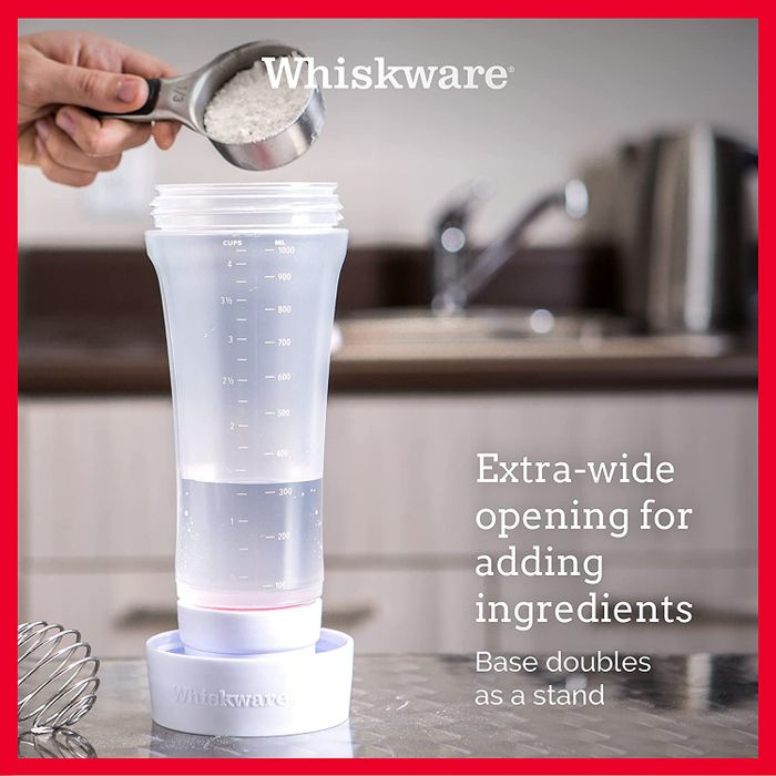 A model adding ingredients to the batter mixer, which is placed in its base for easy mixing.