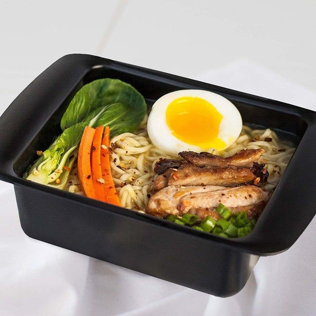 The cooker with ramen and all the ingredients inside, ready to go.