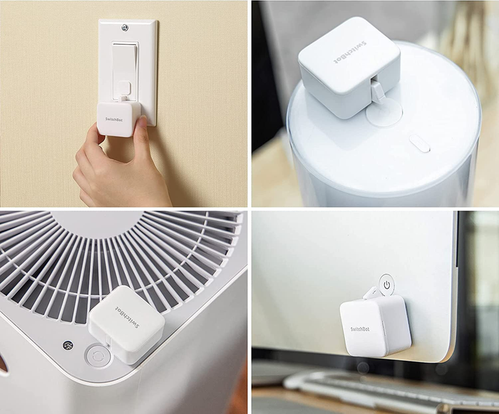 The white, square-shaped SwitchBot on a light switch, fan, and computer
