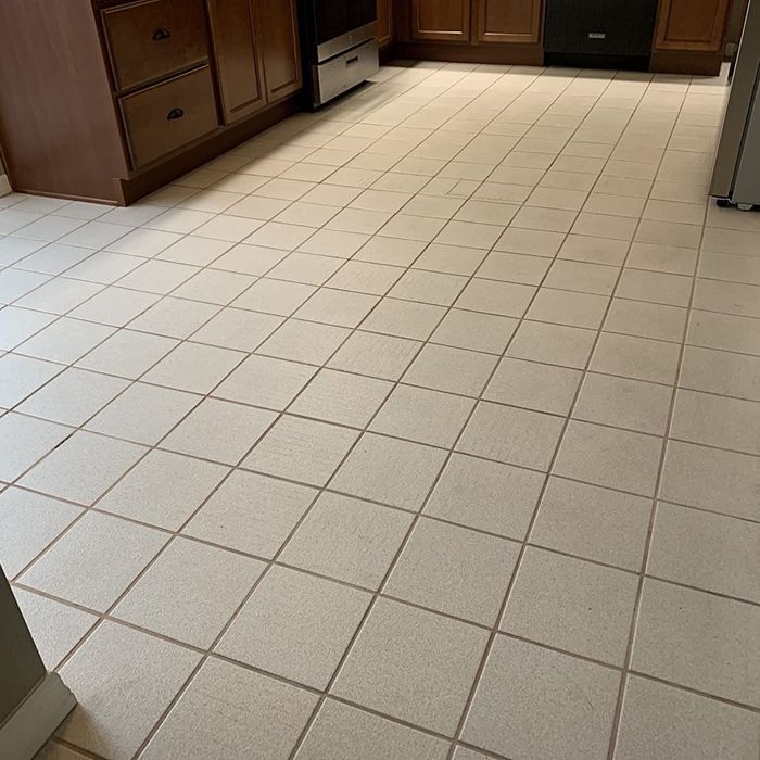 A reviewer photo of a kitchen featuring a white tile floor