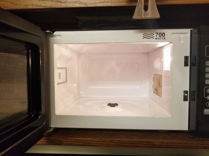 The same microwave, now sparkling clean after using the Angry Mama steam cleaner.