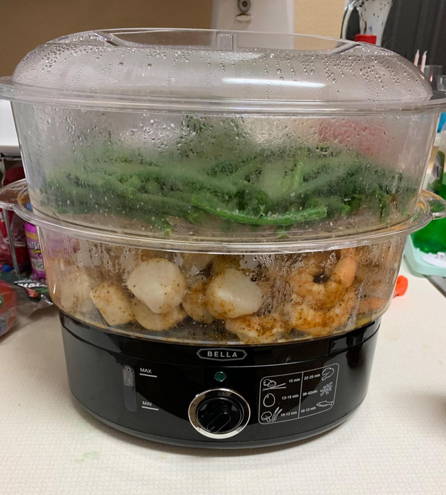 A reviewer’s two-tier steamer filled with green beans and shrimp.