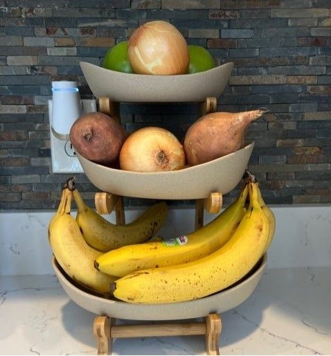A reviewer’s photo showing the fruit basket placed on a white countertop, adding a touch of elegance to the kitchen.
