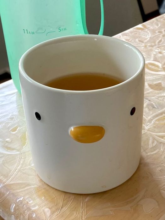 The front view of the duck mug