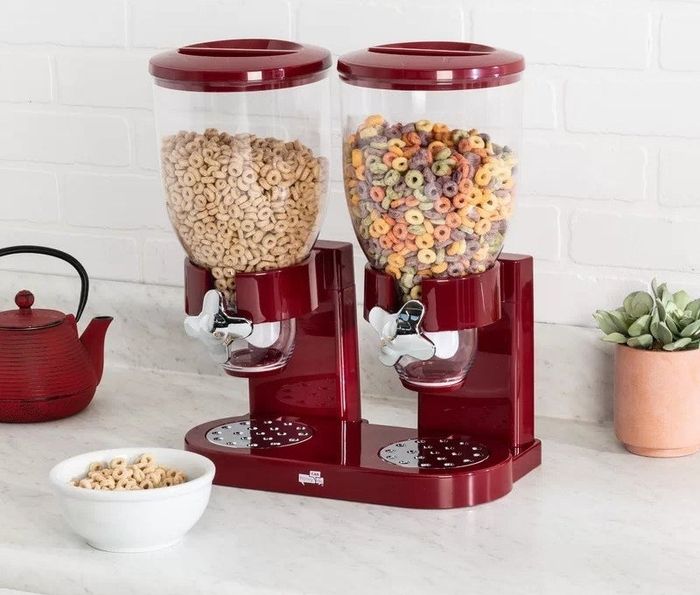 red cereal dispenser placed on the kitchen counter