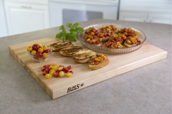 The cutting board topped with food